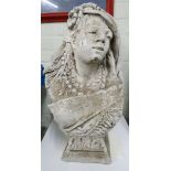 A reconstituted stone of a bust of a young lady