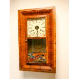 An American striking wall clock in mahogany and decoratively glazed case