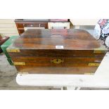 A Regency rosewood brass bound writing box as found
