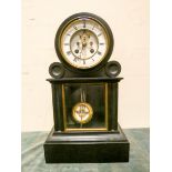 A French striking mantle clock with regulator style pendulum in black marble and glazed case,