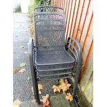 Four stacking metal garden chairs