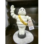 Painted iron Michelin man figure money box