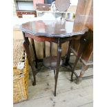 A circular Edwardian mahogany occasional table with under tier