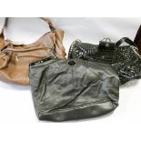 Three ladies designer handbags