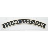 A curved Flying Scotsman cast iron wall hanging plaque