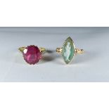 Large oval mix cut synthetic ruby in an 18ct yellow claw setting and shank, ring size K,