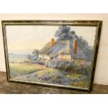 J Noel Smith early 20th century watercolour of a cottage garden, signed lower right,