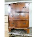 A reproduction bow front Georgian style mahogany chest of three drawers 22" wide