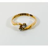 Vintage 18ct gold two stone diamond ring, set in a cross over design,