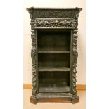 A Victorian carved dark oak open bookcase fitted one drawer 33" wide,