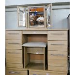 A modern light oak finish kneehole pedestal dressing table fitted six drawers with freestanding