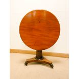 A circular Victorian mahogany snap top occasional or centre table on pillar with triple platform