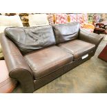 A three seater settee in chocolate brown leather