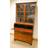 A Georgian mahogany secretaire bookcase with glazed lattice doors fitted interior and three long