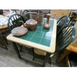 A light beech and green tile top kitchen table together with four matching slat back chairs