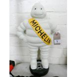 A 15" high cast iron Michelin man standing on tire