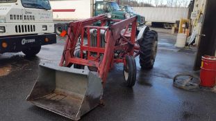 Ford 860 gasoline tractor with front loading bucket and factory wheel weights, live PTO, 2.8L 4 cyli