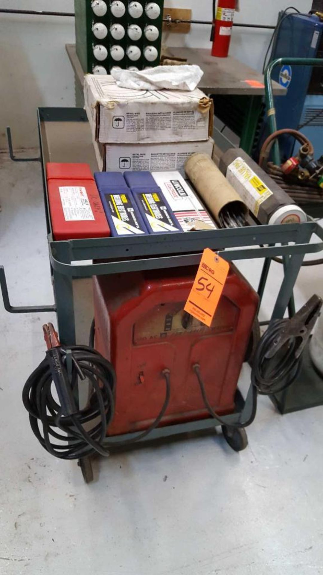 Power-Kraft 180 AC welder with cart, welding rods, and wire