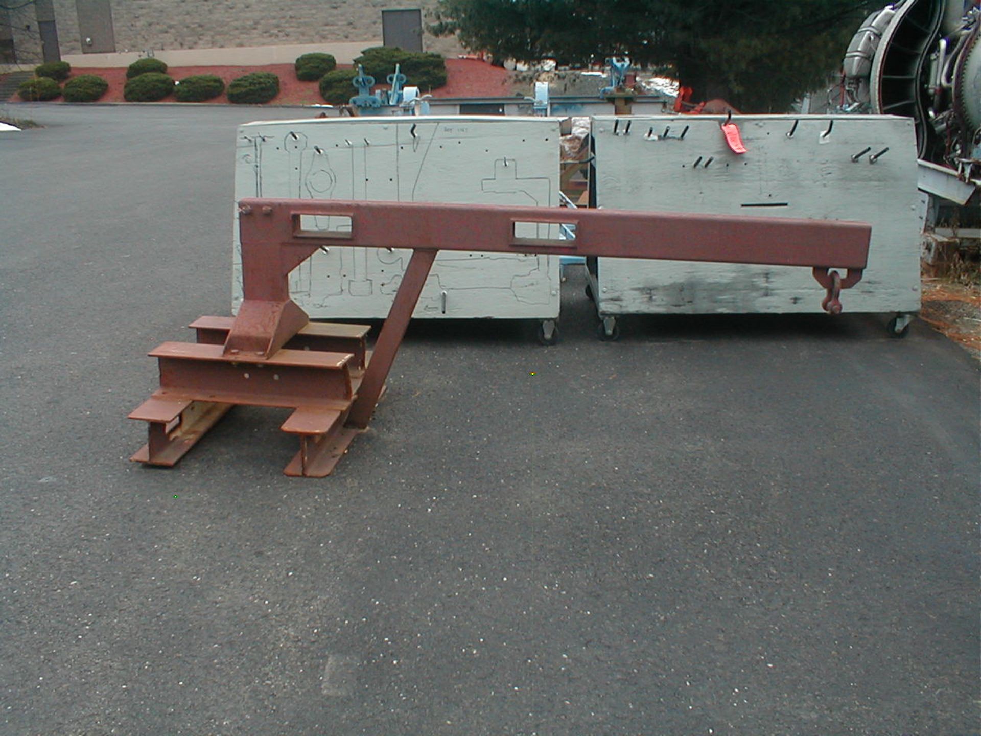 Lot contains (1) drum lifting attachment and (1) 8' long, forklift boom attachment