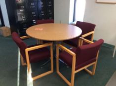 Lot includes (1) 42" diameter conference table and (4) upholstered arm chairs