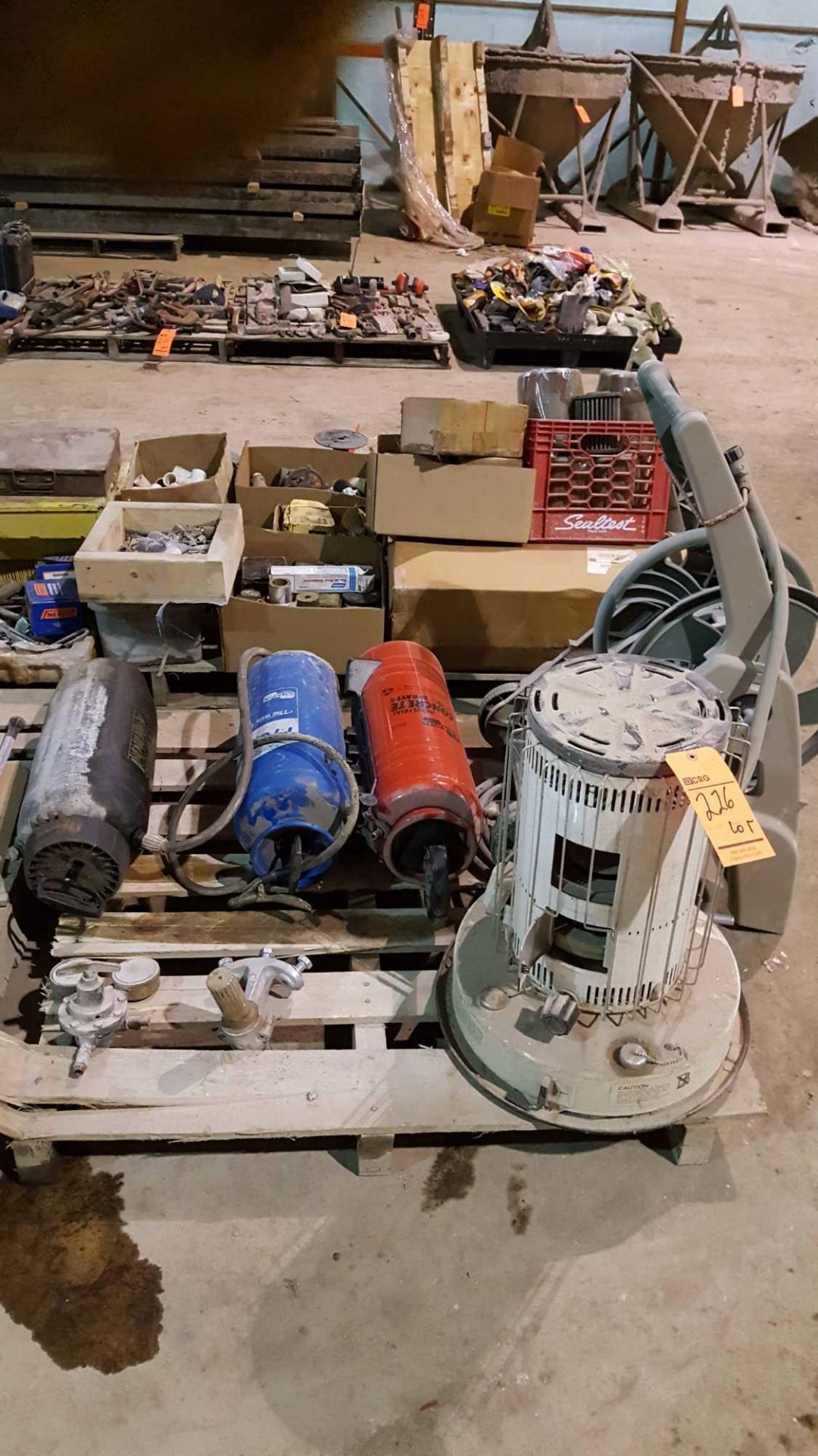 Lot includes (3) assorted sprayer tanks, portable hose reel, and kerosene heater