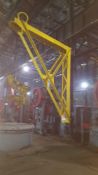 Heavy duty swivel jib crane mounted on building support column approximately 12 ft long bye 14 foot