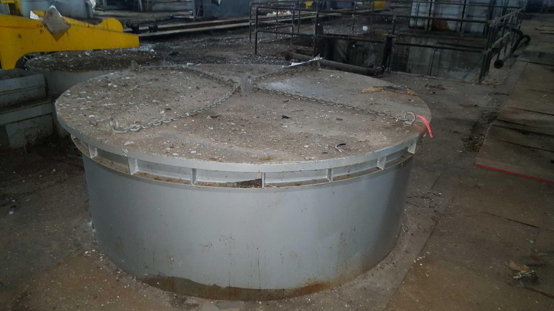 Lot of (2) 7 foot diameter steel cylindrical tank, baskets, and cylindrical steel tanks