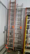 Lot of 3 assorted ladders one 24 foot fiberglass extension ladder, (1) 22 foot aluminum extension la