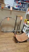 Lot includes one Pilgrim WC3 Bug Wheel firewood cart, two assorted log stands and one leather log ca
