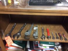 Lot of 10 assorted hand tools, including 2 pipe wrenches and 8 assorted adjustable wrenches.