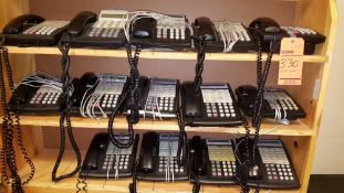 Lot of 14 assorted Avaya telephone handsets.