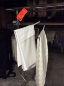 Lot of assorted tablecloths including (23) 96" round white stripe and (19) 96" round ivory stripe