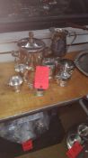 Lot of asst silver serving dishes and pitchers including (7) pitchers, (6) teapots, (9) large