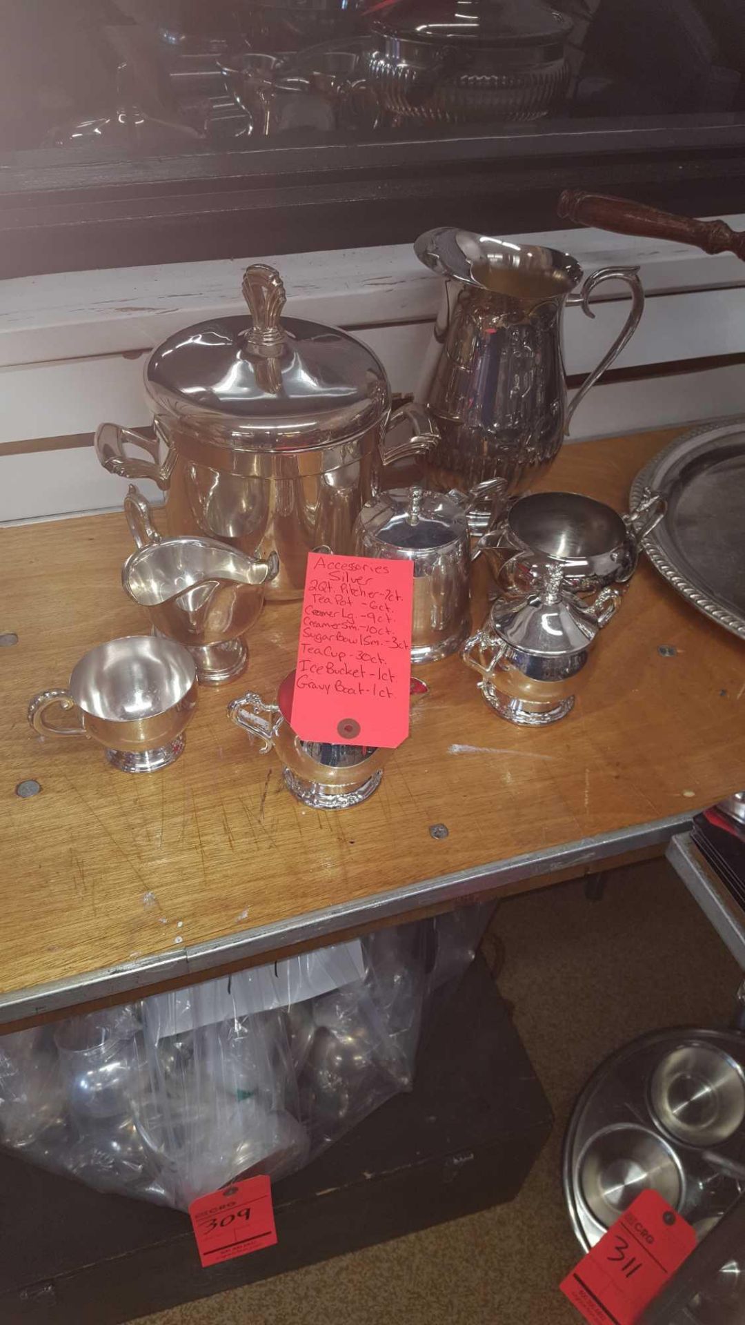 Lot of asst silver serving dishes and pitchers including (7) pitchers, (6) teapots, (9) large