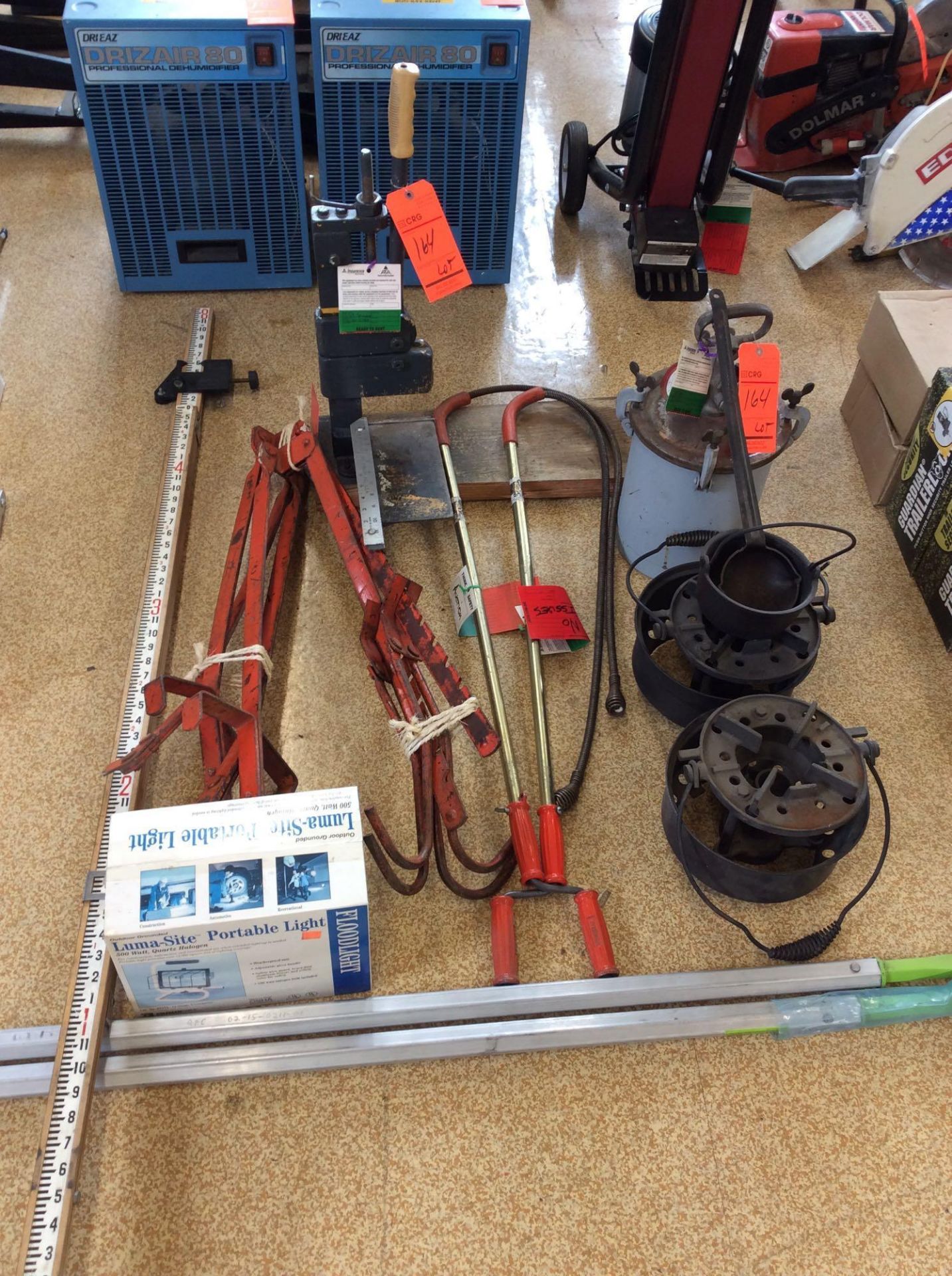 Lot of asst items including (2) aluminum pinch bars, pressure pot, (2) drain snakes, brick