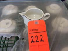 Lot of (109) gold trim china creamers with (9) racks, add'l $8 fee per rack