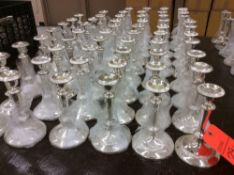 Lot of (57) silver-plated candlesticks, 7.5" tall