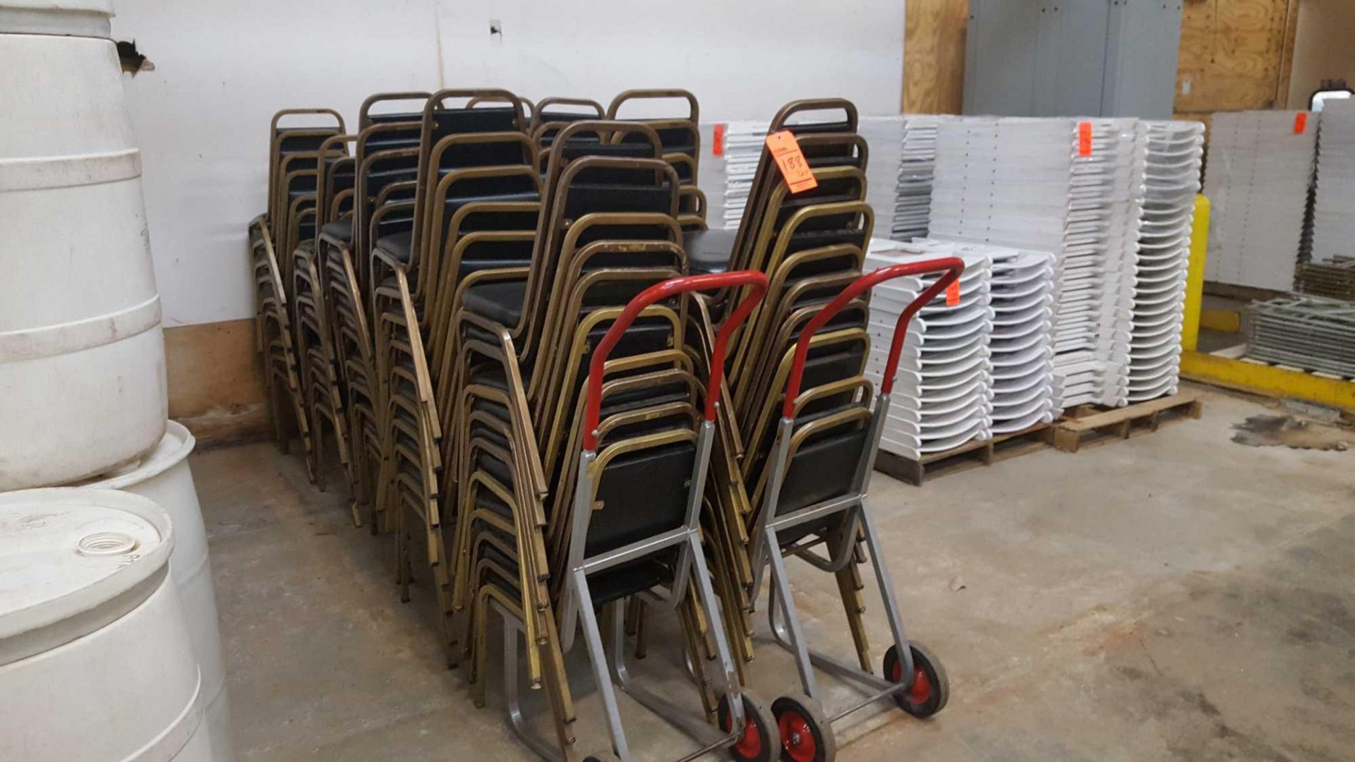 Lot of (98) assorted metal frame upholstered stack chairs with two chair carts