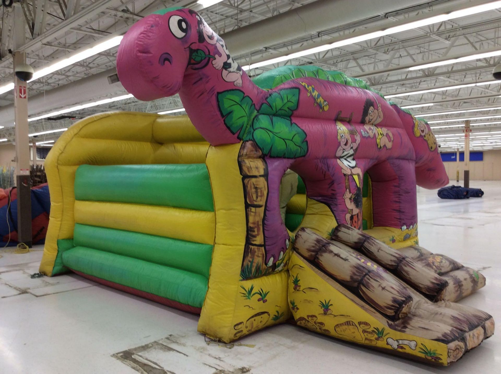 Bee-Tee brand Jurassic themed inflatable bounce house with blower, approx. 14' x 20' overall