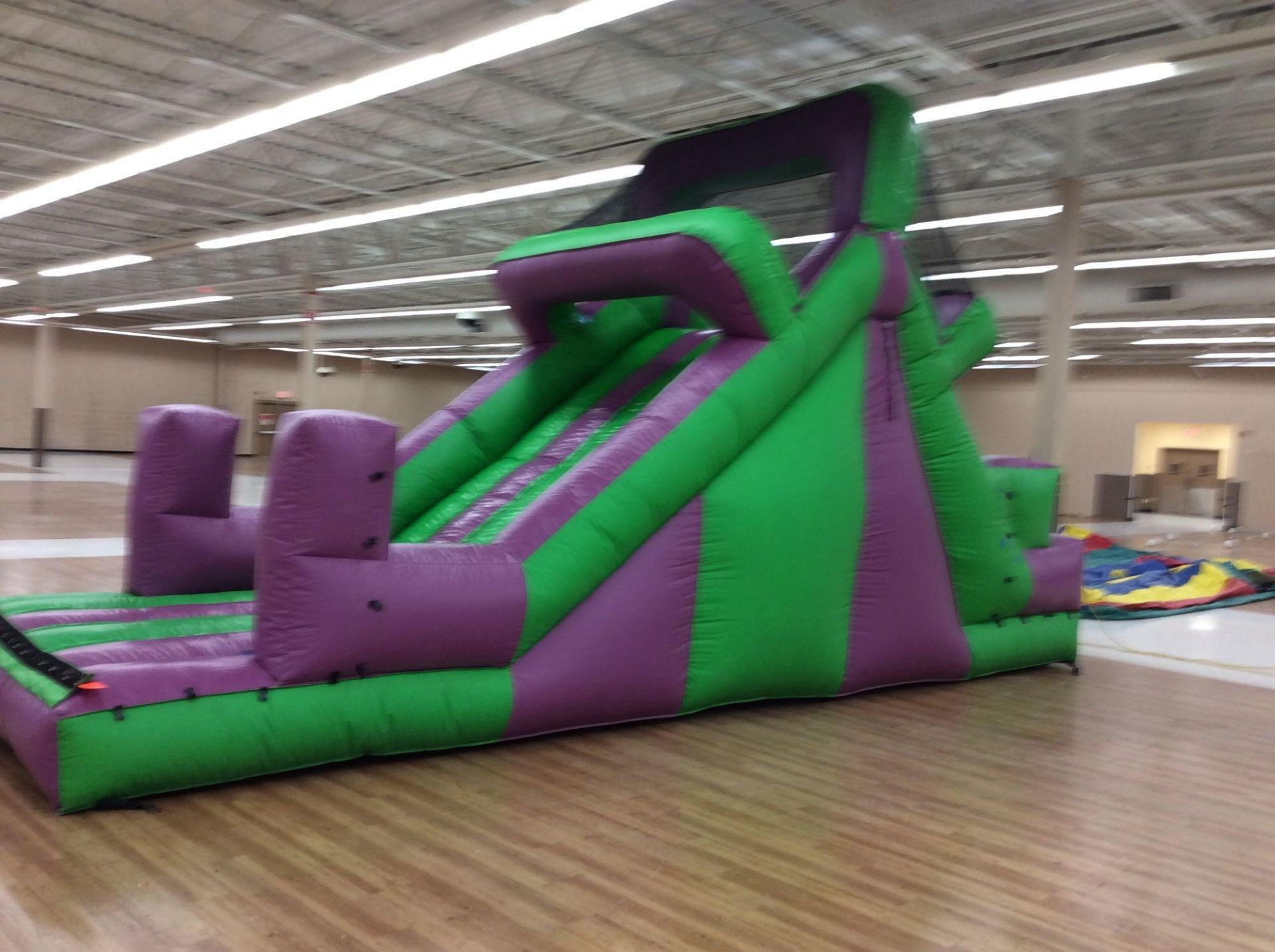 10' x25' inflatable purple and green slide with blower. Can be used in conjunction with lot 217, - Image 2 of 3