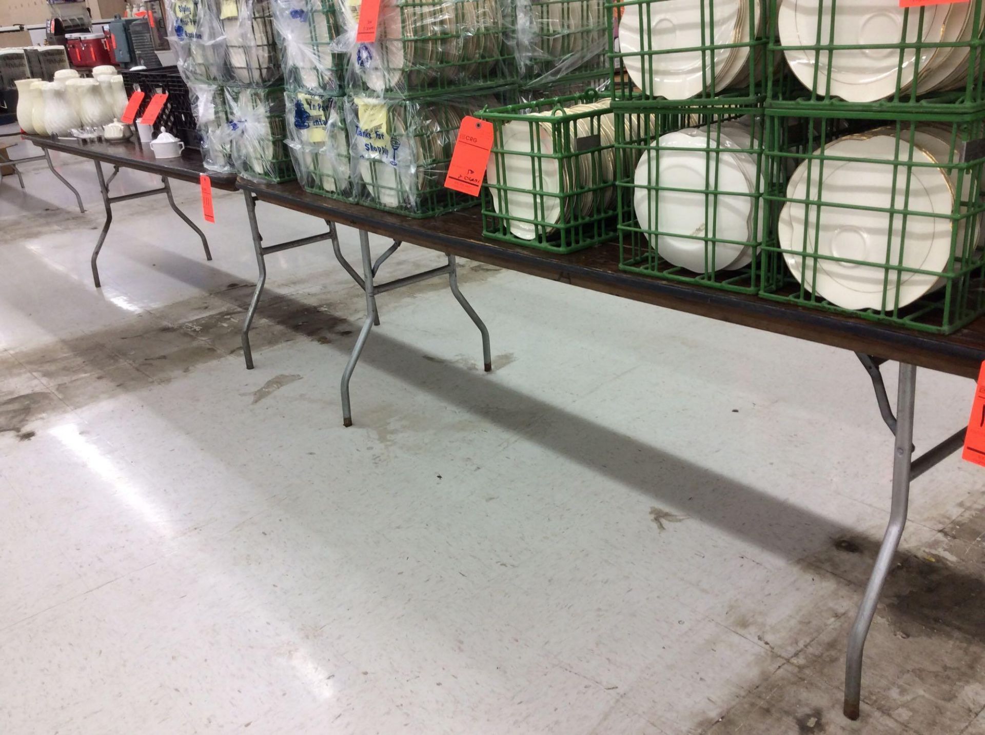 Lot of (15) assorted 8 foot by 30 inch folding leg wood tables, no contents. Purchaser should