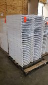 Lot of (50) assorted white resin folding chairs on a pallet