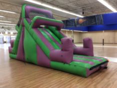 10' x25' inflatable purple and green slide with blower. Can be used in conjunction with lot 217,