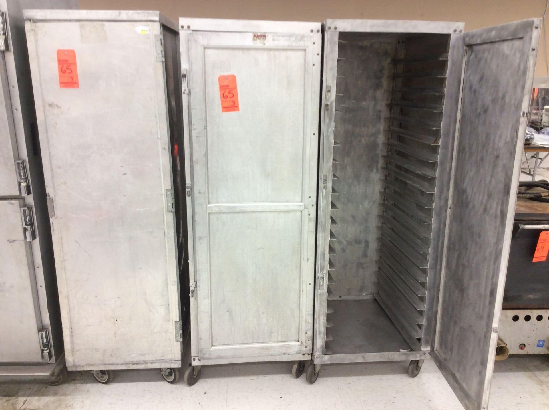 Lot of (3) portable aluminum food tray transports - (2) hold 20 trays each, one holds 40 trays