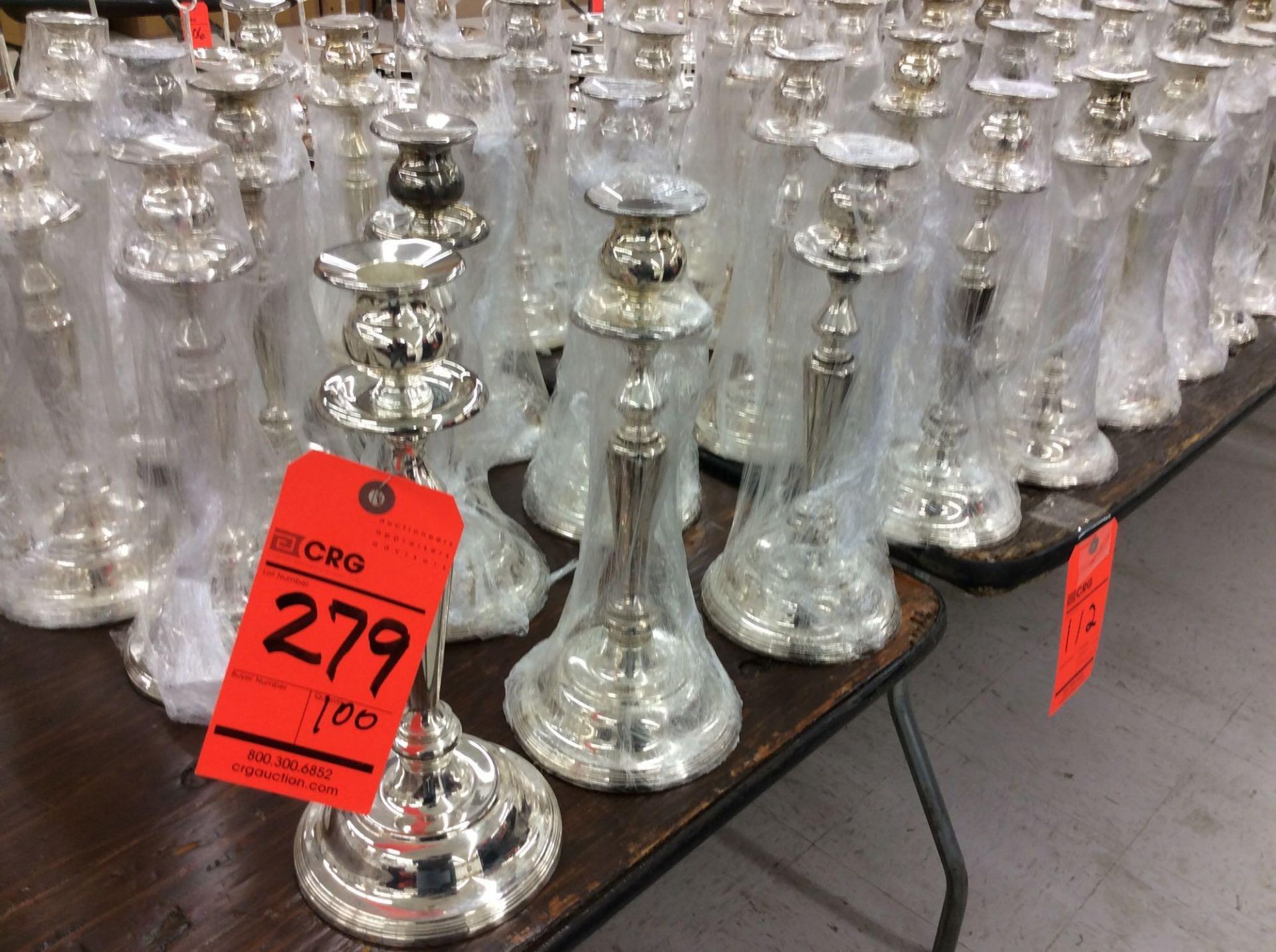 Lot of (100) asst silver-plated candlesticks, approx. 11.5" tall