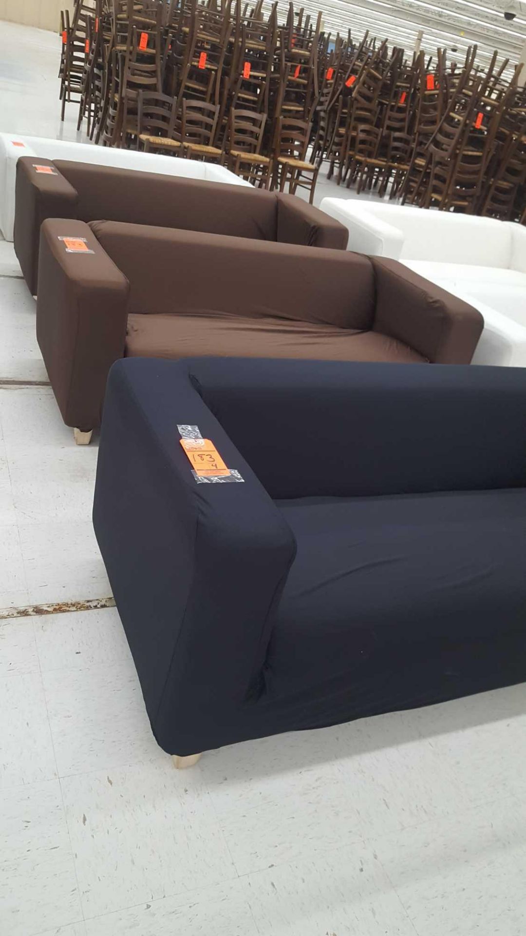 Lot of (4) assorted sofas with interchangeable covers with legs and (1) extra slipcover White