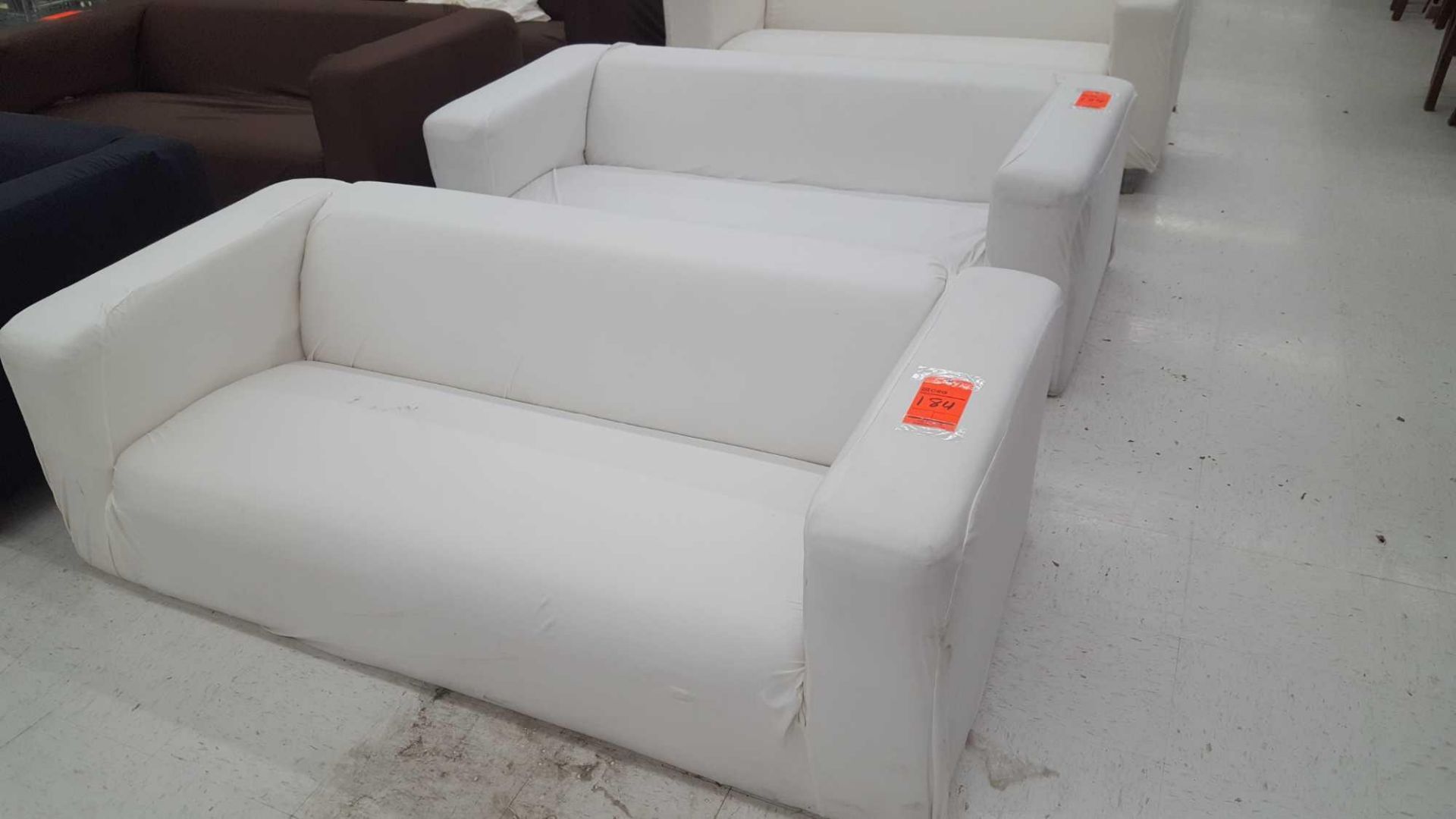 Lot of (3) assorted sofas with white slipcovers, no legs