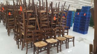Lot of (100) brown ladder back chairs with cane seats