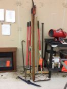 Lot of asst hand tools - includes axe, sledge hammer, pick-axe, post-hole digger, etc.