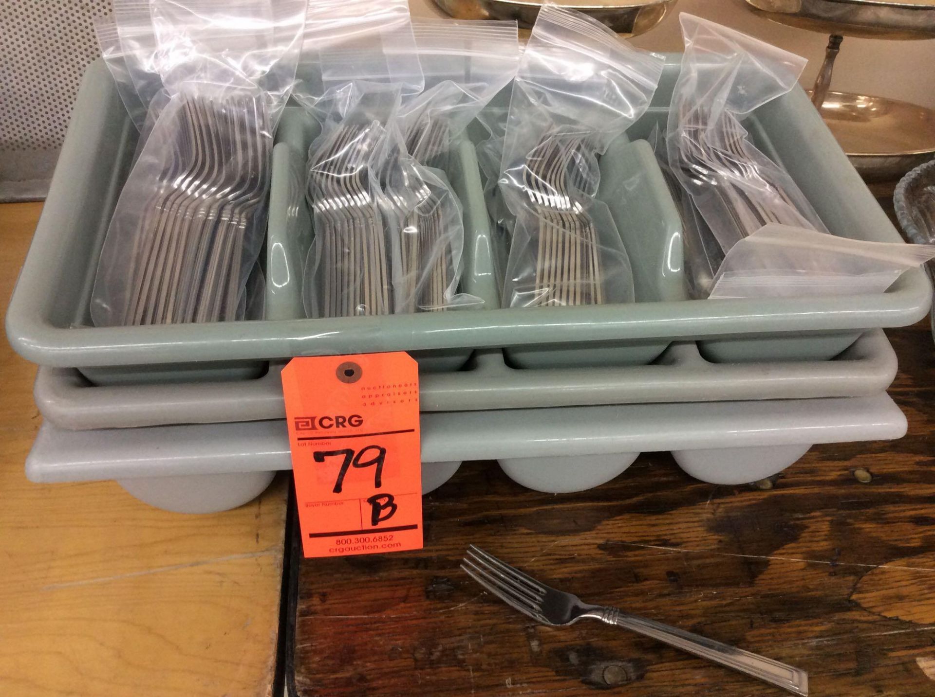 Lot of (110) stainless dinners forks, with (3) flatware separating bins